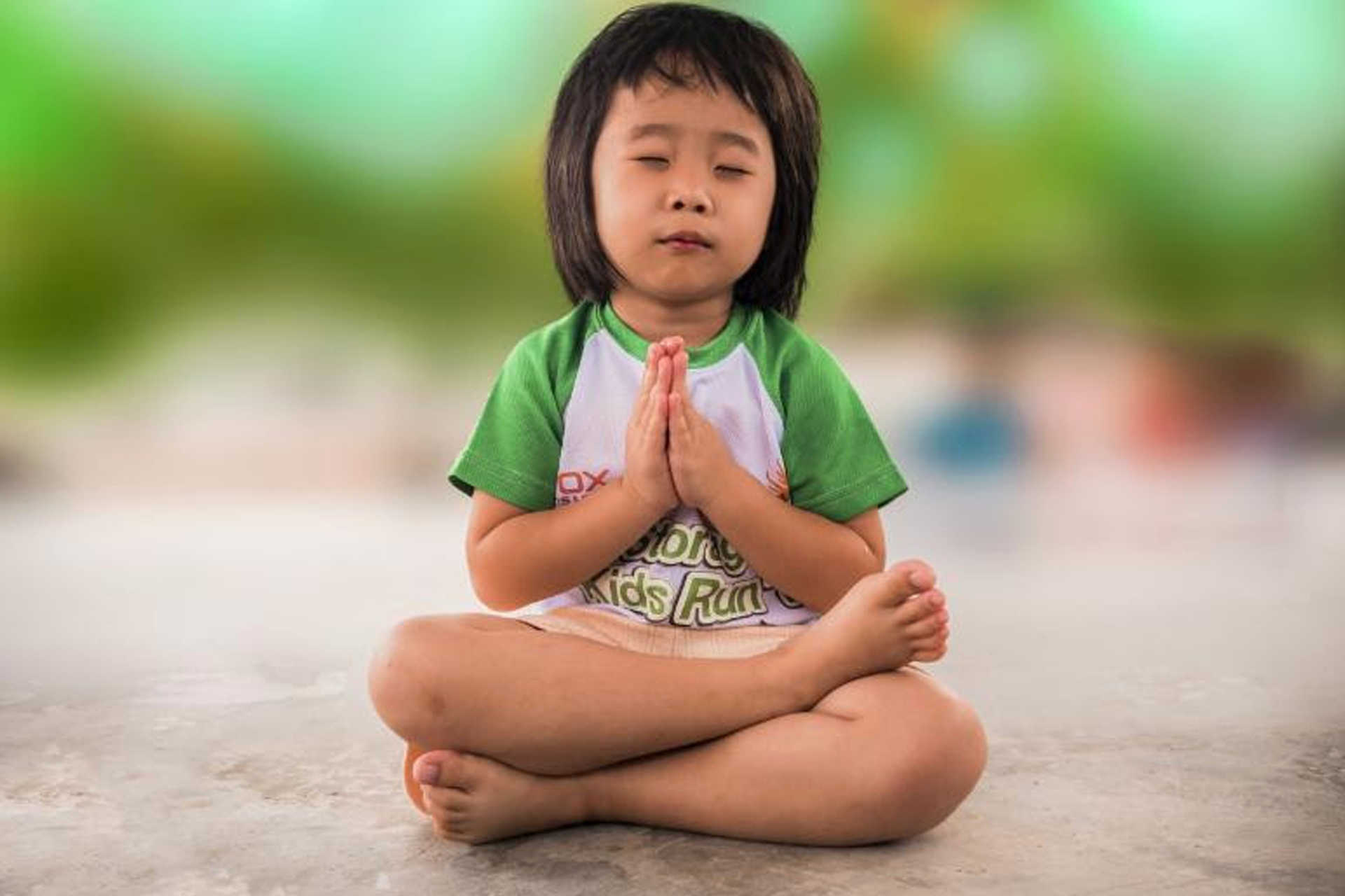 child meditating and praying