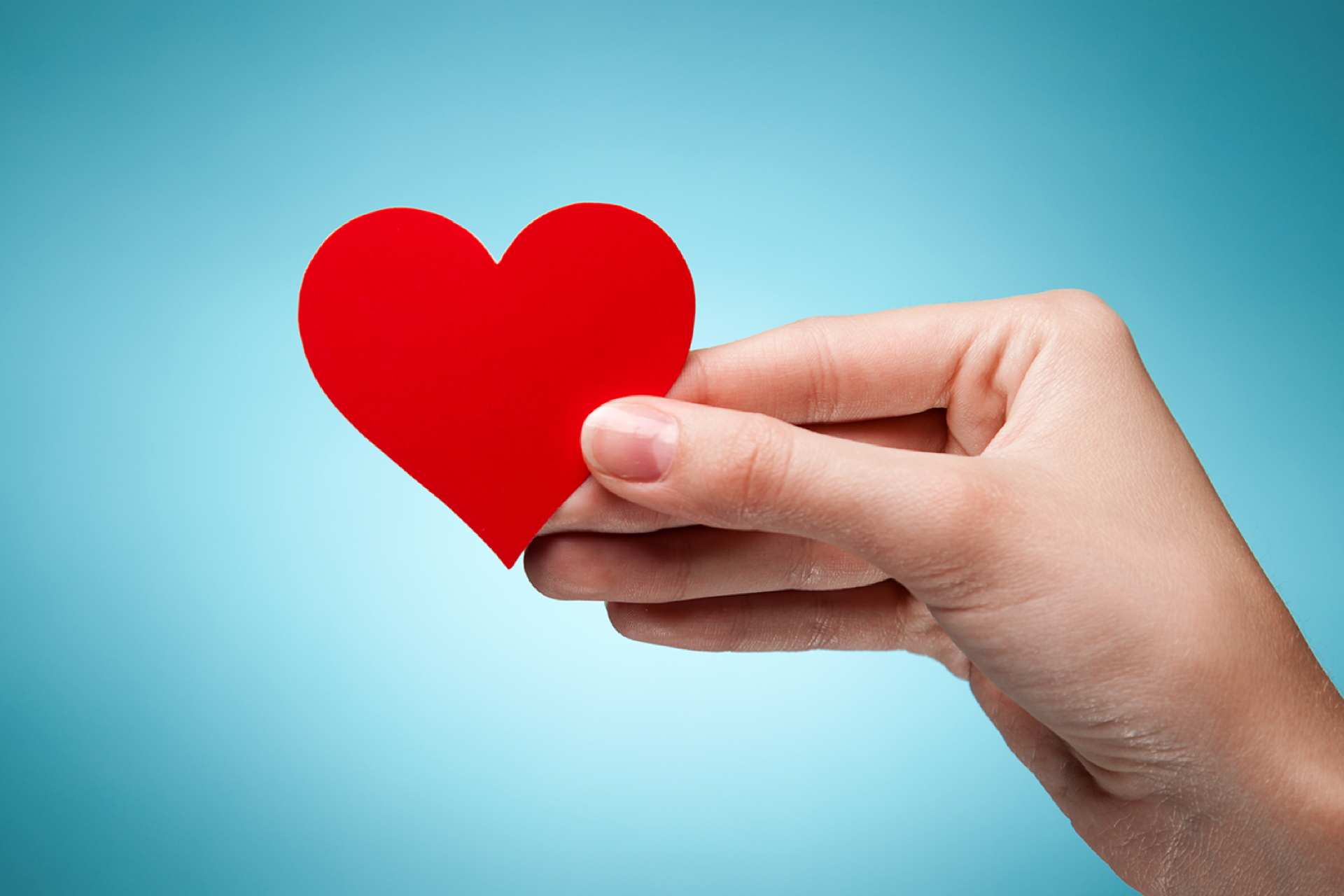 Hand Holding Heart: Kindness in Action